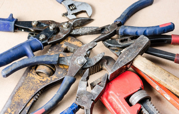 Pile of old tools for construction and repair of plumbing . - 写真・画像