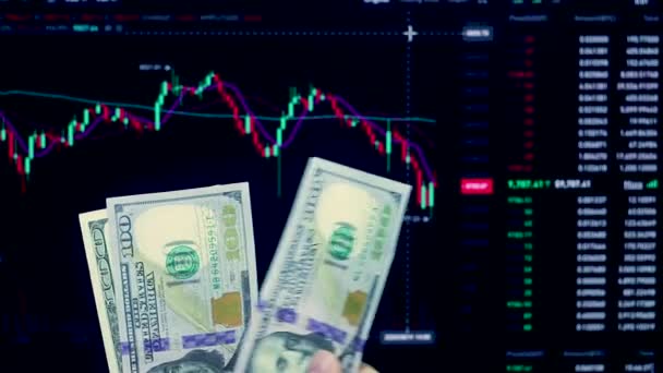 Count money in US Dollars.The price of money on the chart exchange, work on the currency market and Forex.Price analysis.Lot with US Dollars hands in hand before the trading price chart. - Footage, Video