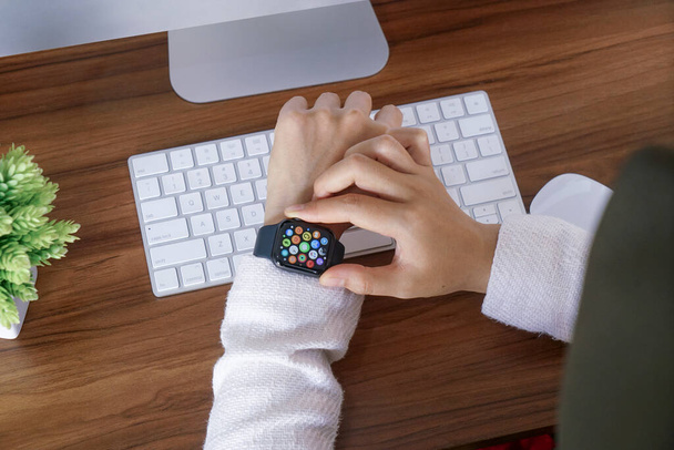 Bali Indonesia June 12, 2020 : female hands using with apple, Apple Watch is a line of smartwatches designed, developed, and marketed by Apple Inc. - Foto, Bild