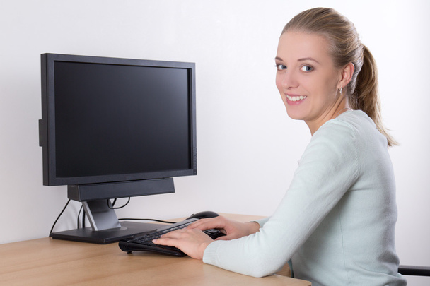 Woman using pc with copy space on screen - Photo, Image