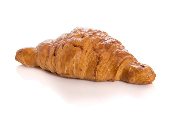 Homemade croissant isolated on white background with reflection. - Photo, Image