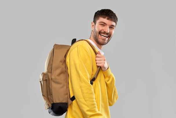 happy smiling young man with backpack - Photo, image