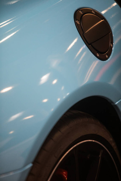 Close up shot of a car's fuel reservoir lid. - Foto, afbeelding