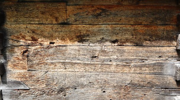 wood texture as background. Top view of the surface of the table for shooting flat lay. Abstract blank template. Rustic Weathered Wood Shed with Knots and Nail Holes. - Fotó, kép