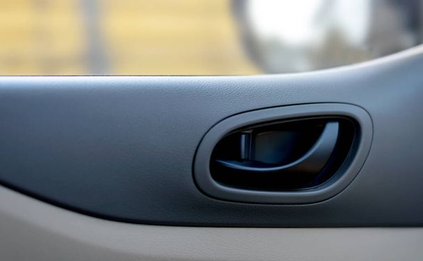 closeup car door handle with soft-focus and over light in the background - Fotó, kép