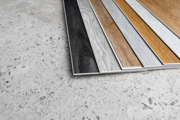 laminate flooring planks variations on concrete floor - Photo, Image