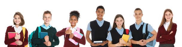 Children in school uniforms on white background. Banner design - Foto, afbeelding