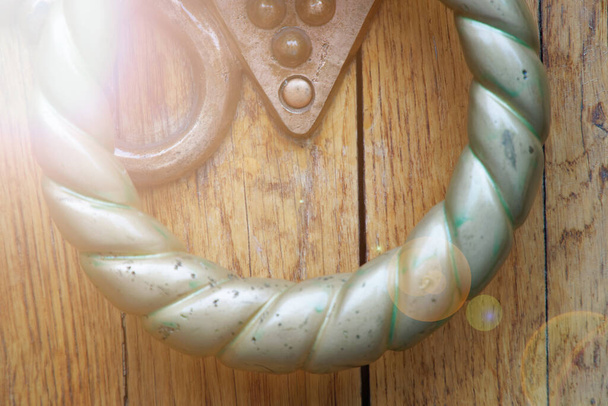 Doorknocker close-up, details of old wooden door. - Photo, Image