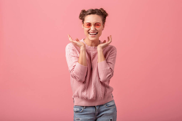 young pretty exited laughing woman with funny face in pink sweater and sunglasses in spring style trend isolated on pink studio background - Φωτογραφία, εικόνα