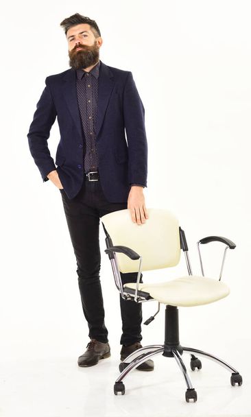 Full portrait of businessman stands near the chair - Φωτογραφία, εικόνα
