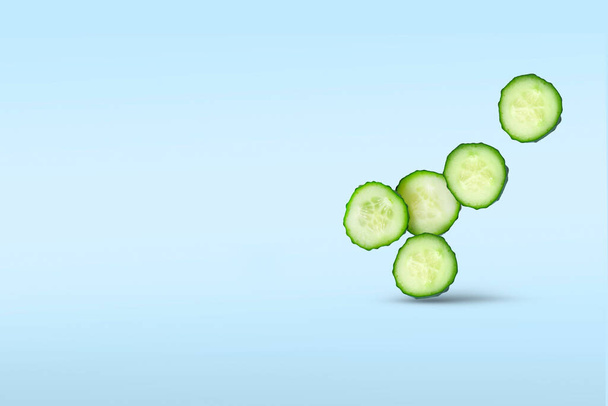 Five sliced slices of fresh cucumber closeup soar in the air casting a shadow on a blue background.Concept of flying vegetables, food levitation. Copy space for text. - Foto, imagen