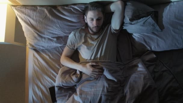 sleepless night insomnia problem tired man anxiety - Materiał filmowy, wideo