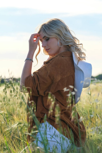 beautiful blonde girl with white hat and icy country. High quality photo - Valokuva, kuva