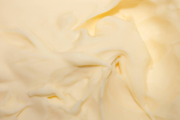 Melted cream cheese.Background of melted cream cheese. - Foto, afbeelding