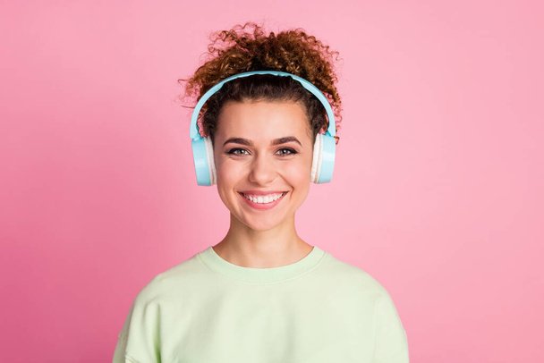 Portrait of nice cute pretty youngster girl enjoy listen wireless headset music play list wear good look outfit isolated over pastel color background - Fotografie, Obrázek