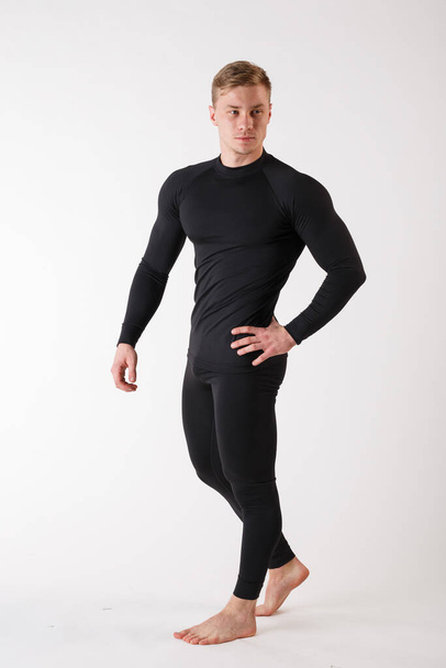 The guy in thermal underwear on a white background. Sportswear. - Photo, image