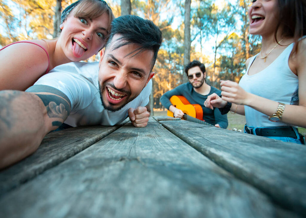 group of young people take a selfie in a funny way - Foto, afbeelding