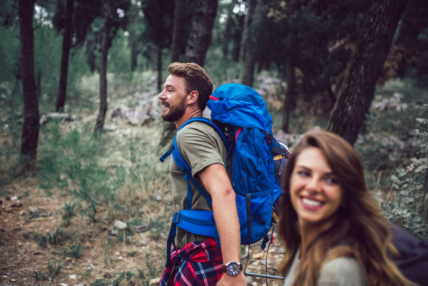 Romantic couple hiking on the path in mountains - Photo, Image