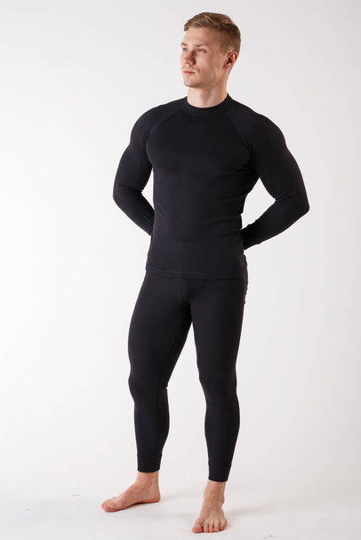 The guy in thermal underwear on a white background. Sportswear. - Foto, Imagem