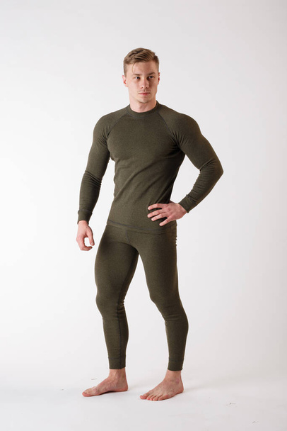 The guy in thermal underwear on a white background. Sportswear. - Photo, Image
