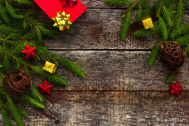 Christmas background for greeting card. Fir branches on wooden background. - Фото, изображение