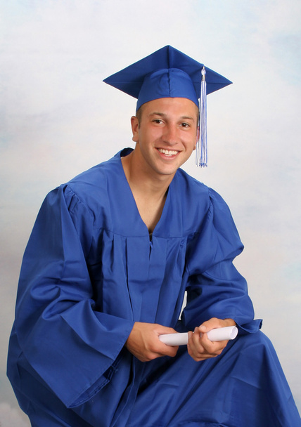 Young man in cap and gown with diploma - Fotoğraf, Görsel