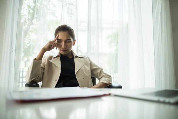 Young business people are suffering from headaches - Photo, Image