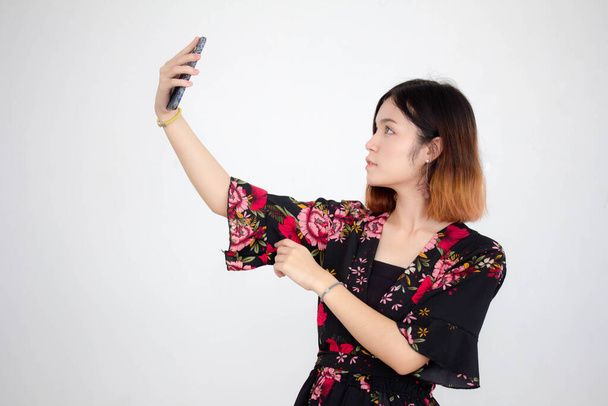 Portrait of thai adult beautiful girl short hair using her smart phone Selfie - Fotó, kép