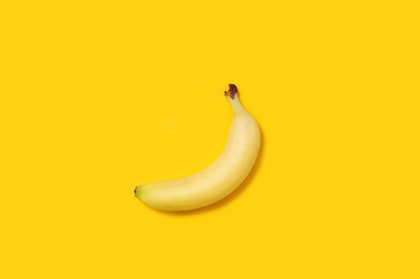 fresh ripe banana on yellow background, close view - Photo, Image