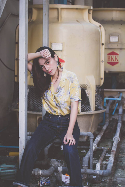Portrait of thai yellow shirt adult beautiful girl relax time, in Vintage Style - 写真・画像