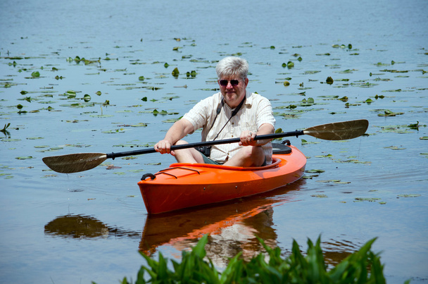 Man exercising in a kayak - Photo, Image