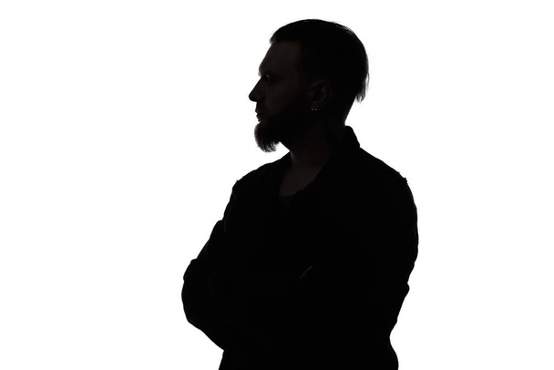 Silhouette of bearded man with arms crossed - Photo, Image