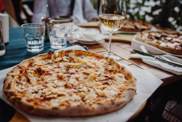 Italian pizza in a restaurant - Photo, Image