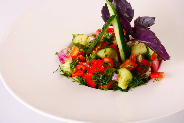 Choban salad. Cucumber and tomato salad with greens. White background - Фото, зображення