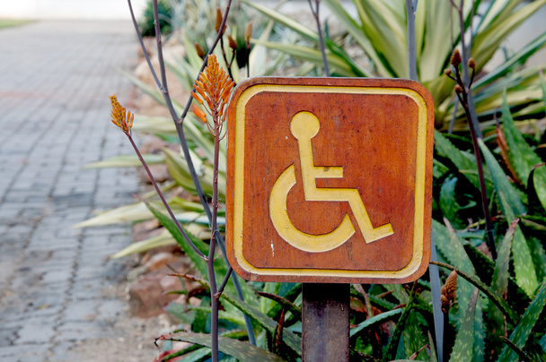 cripple sign wood label in garden - Photo, Image