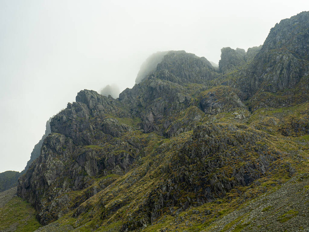 Rocks lost in the clouds near the summit of Scafell Pike - Photo, Image