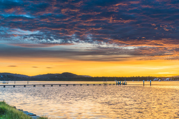 Sunrise Waterscape with Clouds at Woy Woy Waterfront on the Central Coast, NSW, Australia. - Fotoğraf, Görsel