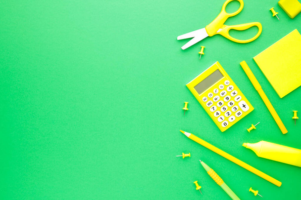 School supplies on green background. Back to school. Flat lay. Top view - Photo, image