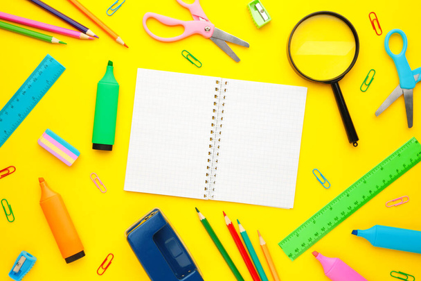 Back to school concept on yellow background. School stationery with copy space - Photo, Image