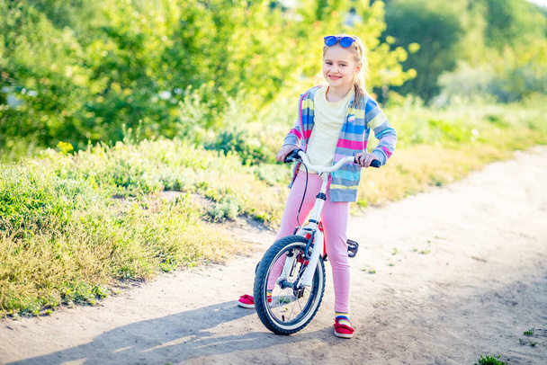 Little girl with bicycle - 写真・画像