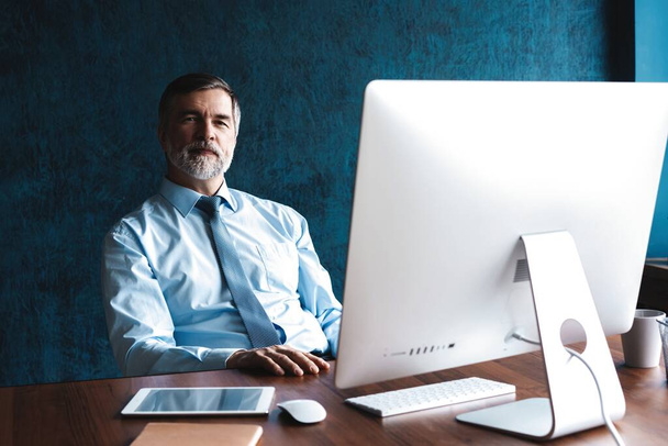 Mature Businessman Working On Computer In Office - Photo, Image