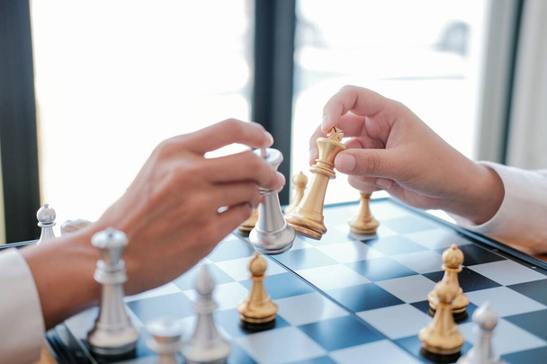 Businessman play with chess game. success management concept of business strategy and tactic challenge - Photo, Image