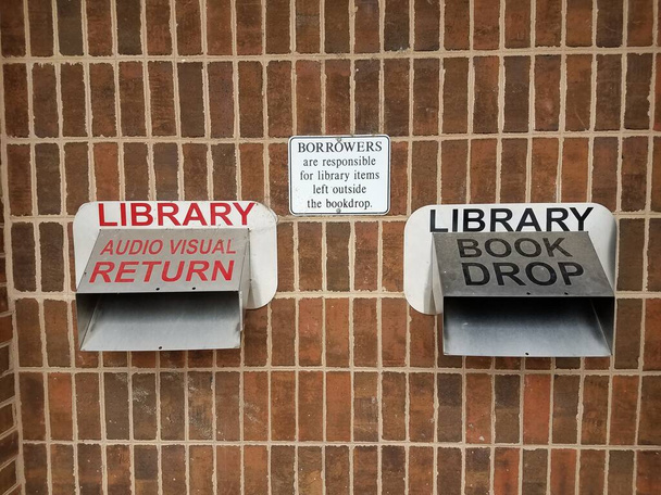 metal library book and audio visual return chutes and signs - Photo, Image