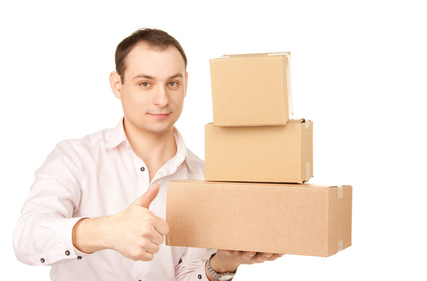 Businessman with parcels - Foto, imagen