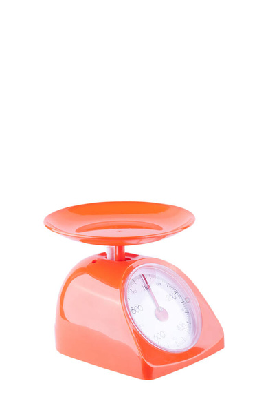 orange weight scales on white background kitchen equipment object isolated - Photo, image