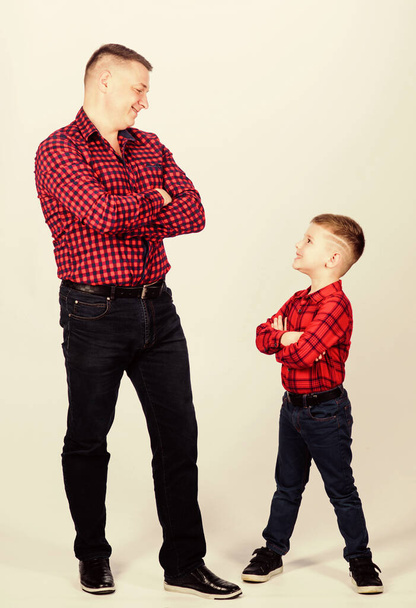 Father little son red shirts family look outfit. Best friends forever. Happiness being father of boy. Dad and adorable child. Parenthood concept. Fathers day. Father example of noble human. Cool guys - Fotó, kép