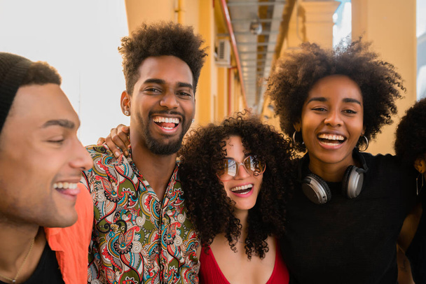 Portrait of Afro friends having fun in the city and spending good time together. Friendship and lifestyle concept. - Foto, imagen