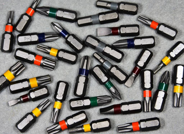 A high angle closeup shot of different screwdriver tips - Foto, Imagem