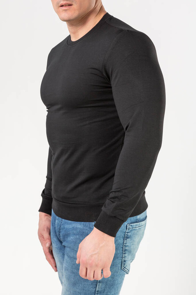 man in black turtleneck with long sleeves on white background, mock-up, copy space - 写真・画像