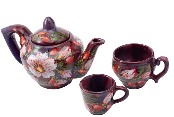 Set da tè con fiori su sfondo bianco
 - Foto, immagini